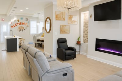 Bright common area with comfortable seating and decor