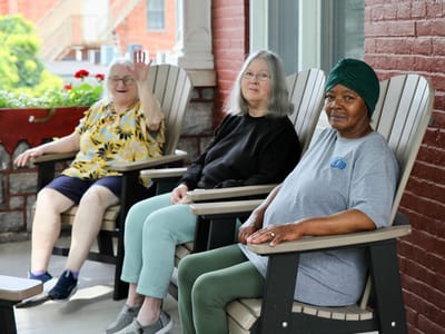Residents enjoying time outdoors in comfortable seating