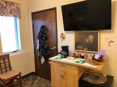 Cozy resident room with a coffee station and decorative art