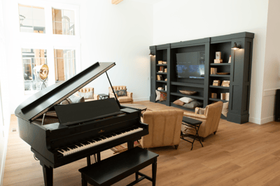 Cozy common area with piano and seating