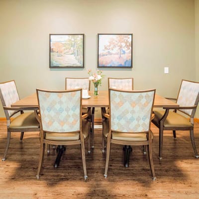 Bright dining area with a floral centerpiece