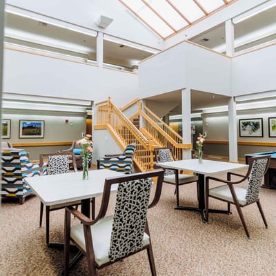 Bright interior common area with seating and artwork
