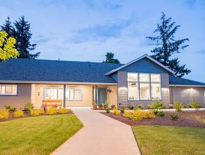 Exterior view of Gateway Living facility at dusk