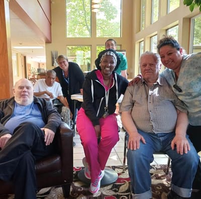 Residents and staff socializing in a common area
