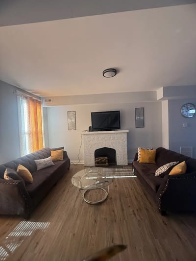 Cozy common area with sofas and a fireplace