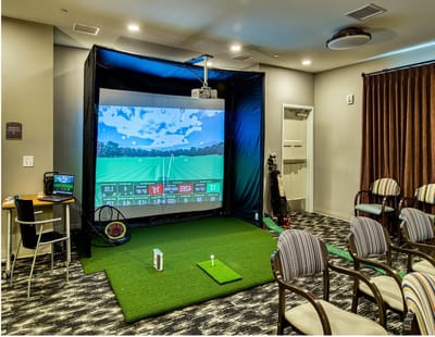 Indoor golf simulator set up for residents to enjoy