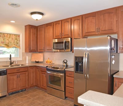 Bright kitchen with wooden cabinets and modern appliances