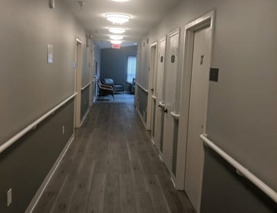 Interior hallway with resident rooms and seating