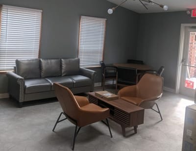 Cozy common area with seating and natural light
