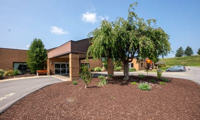 Exterior view of William Penn Senior Suites with landscaping