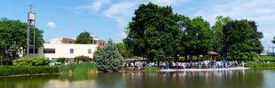 Residents enjoying a sunny day by the lake