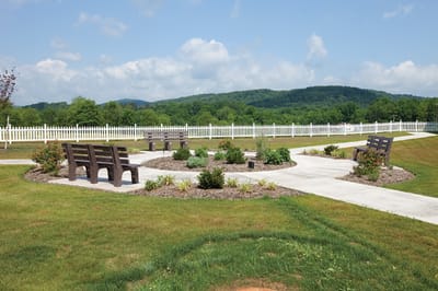 Outdoor seating area with benches and garden
