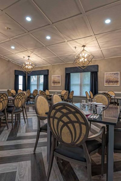 Interior of a dining room with elegant seating and lighting