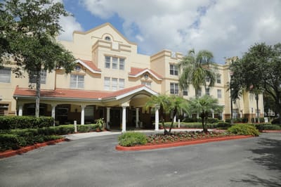 Exterior view of the facility with landscaped entrance