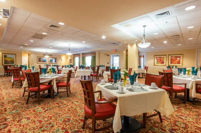 Dining room with tables set for residents