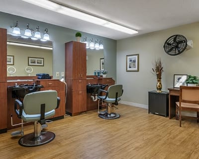 Brookdale South Bay, nursing home in Torrance, CA — Hair salon setup with styling chairs and mirrors