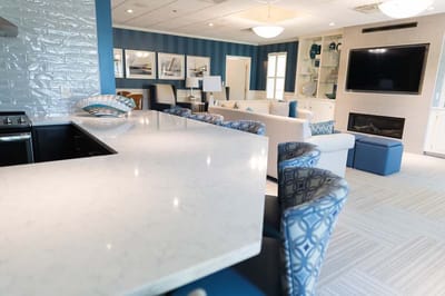 Bright common area with seating and television