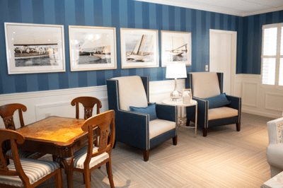 Bright common area with seating and decorative photos