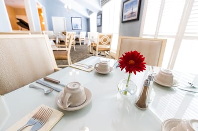 Elegant dining setting with flowers and utensils