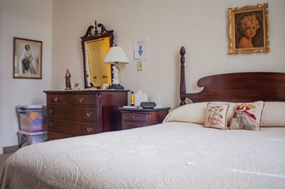 Cozy resident room with a bed and dresser