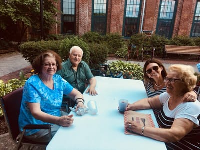 Residents enjoying time together in an outdoor garden