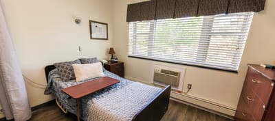 Private resident room with a bed and window