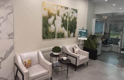 Bright interior lounge area with seating and decor