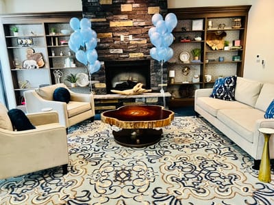 Cozy common area with stylish furniture and balloons
