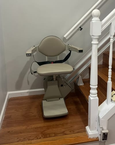 Stairlift on a wooden staircase in an interior setting