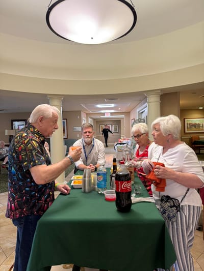 Residents engaging in a social event with drinks
