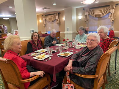 Residents enjoying a meal in the dining room
