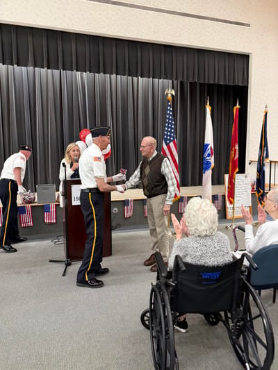 Residents and staff participating in a celebratory event