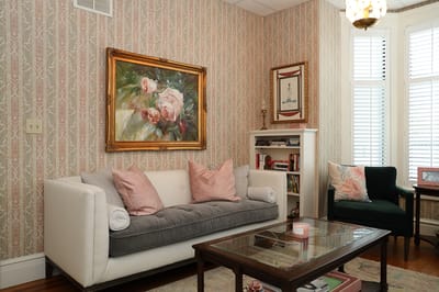 Cozy common area with painting and comfortable seating