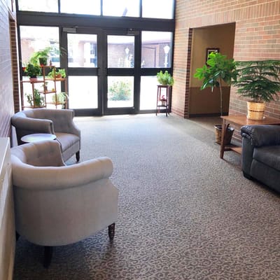 Bright common area with seating and plants