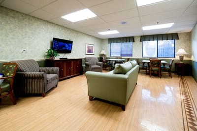 Interior lounge area with furniture and television