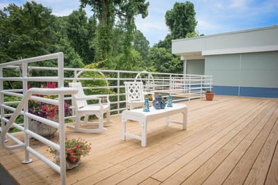 Outdoor seating area with plants and chairs