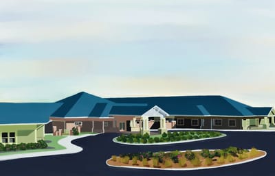 Exterior view of a senior living facility with landscaped entrance