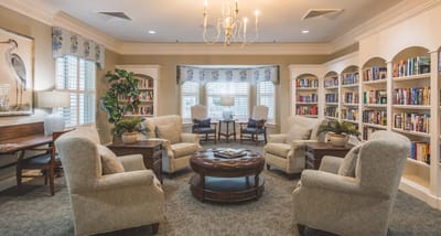 Cozy common area with comfortable seating and bookshelves