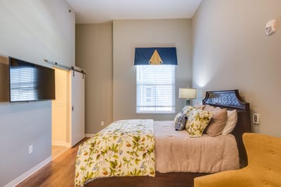 Cozy private room with a bed and TV