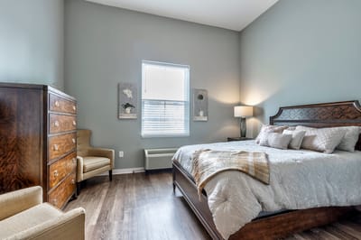 Cozy resident room with a bed and furniture