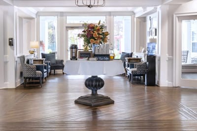 Bright lobby space with floral decoration and seating areas
