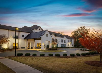 Exterior view of Somerby Edgewater with evening sky.
