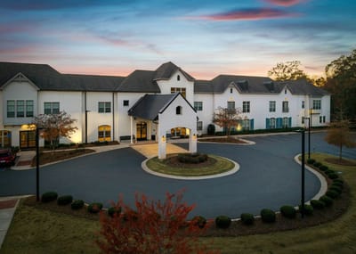 Exterior view of Somerby Edgewater facility at sunset