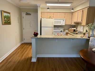 Bright kitchen area in a senior living unit