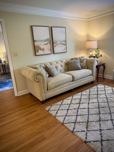 Comfortable living room with a couch and art on the walls
