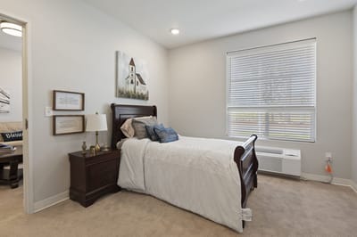 Cozy interior of a private resident room with bed