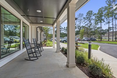 Porch area with rockers and garden view