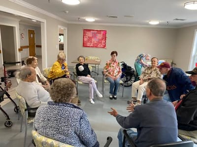 Residents engaged in a group activity in a common area