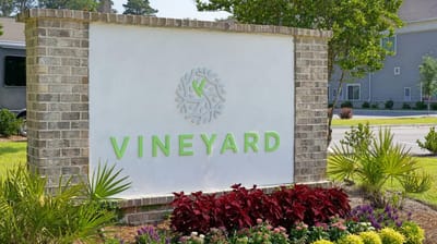 Vineyard Bluffton facility logo on a stone sign