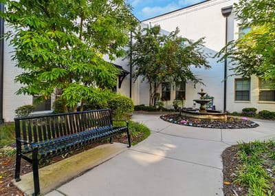 Outdoor space with fountain and seating area